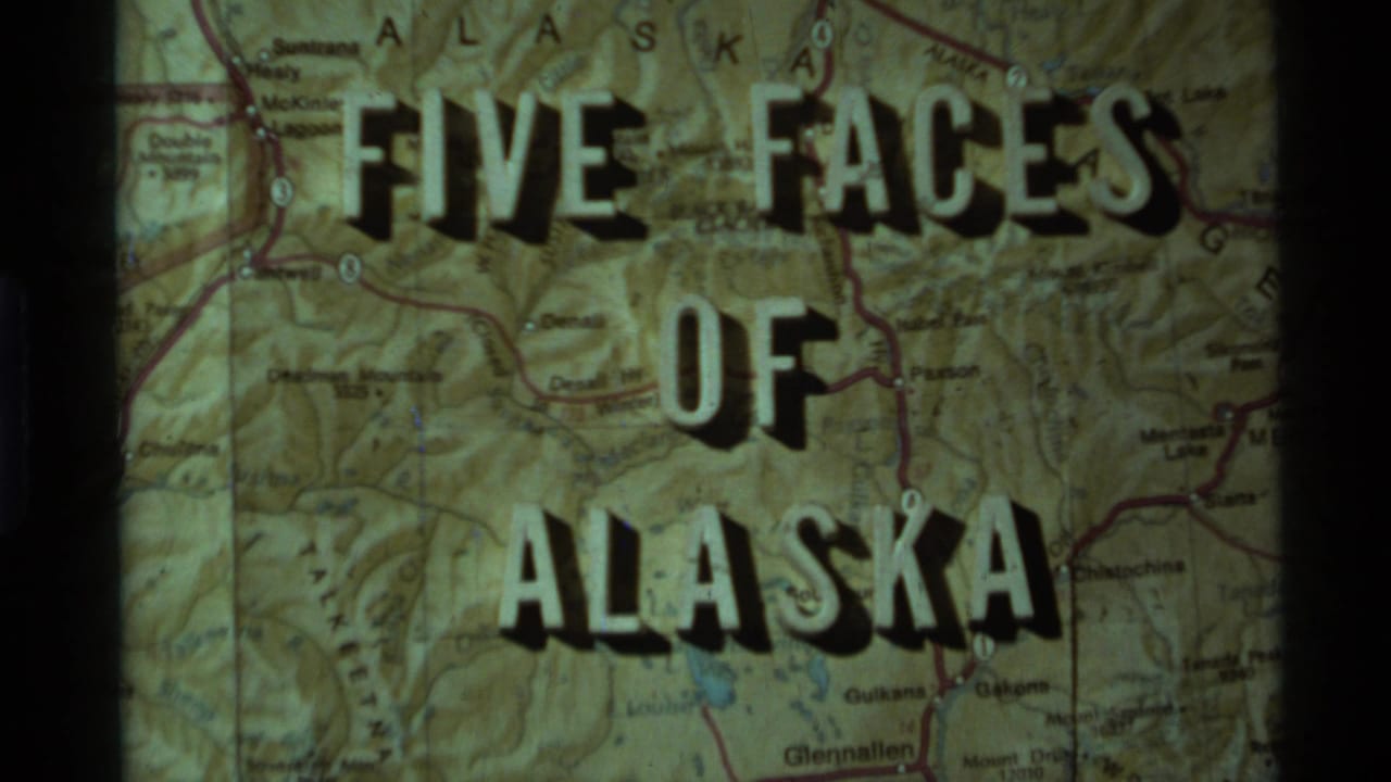 1977 Alaska 8mm title card reading Five Faces of Alaska projected over a detailed state map.