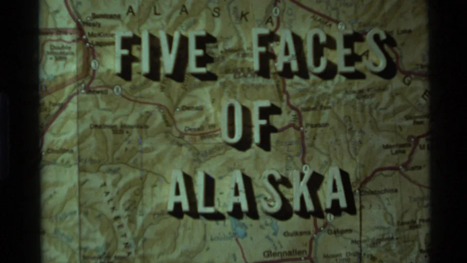 1977 Alaska 8mm title card reading Five Faces of Alaska projected over a detailed state map.