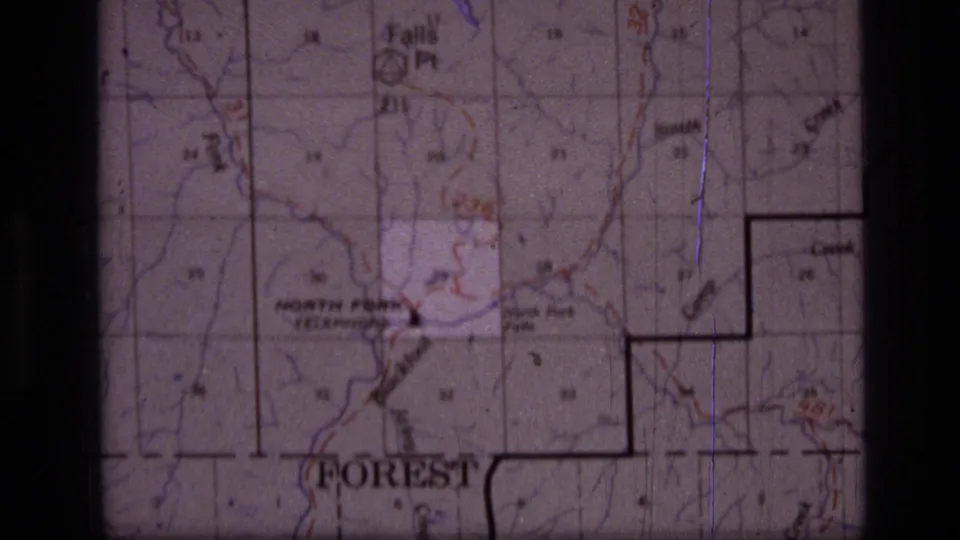 1973 8mm view of the Scapegoat Wilderness map with North Fork, boundary markings, grid lines, and faded color from the film scan.