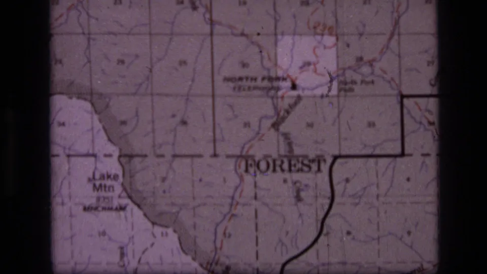 1973 8mm frame of a Scapegoat Wilderness, Montana topographic map showing Lake Mtn, North Fork, boundary lines, and contour detail.