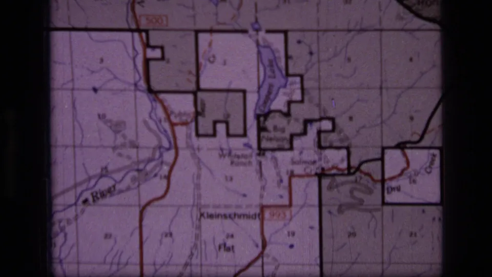 Scapegoat Wilderness map detail filmed in 8mm, with river markings, grid divisions, place names, and heavy black boundary outlines.