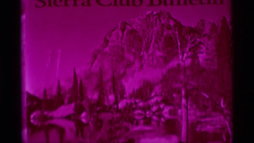 Magenta 8mm view of the Sierra Club Bulletin cover, showing a printed mountain landscape and visible masthead text.