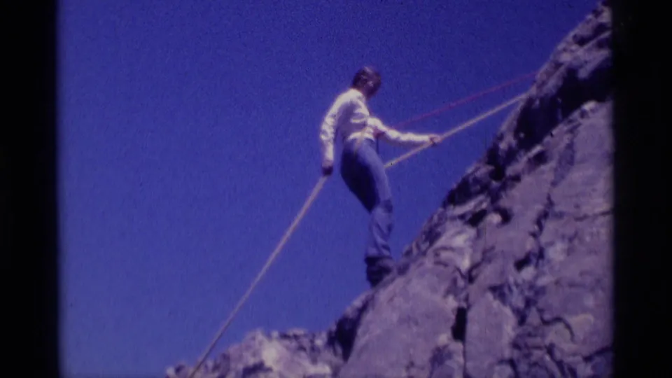 1975 8mm home-movie frame of a roped climber on rocky terrain in Minaret Wilderness, California.