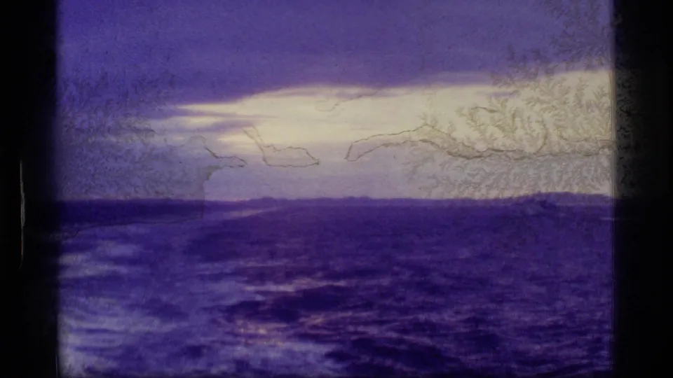 The final frame shows a purple-tinted ocean horizon during low light, with distant landforms and pronounced 8mm scratches and texture.
