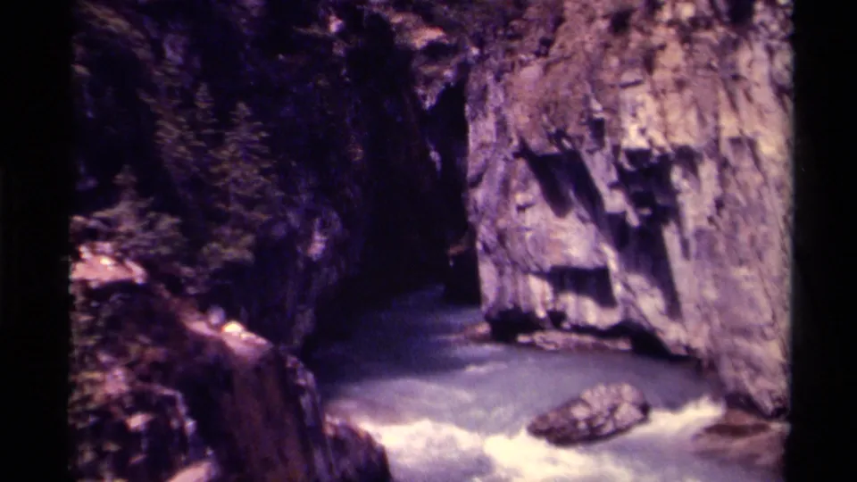 1979 Canada 8mm frame of churning rapids, steep stone formations, and a visible midstream rock.