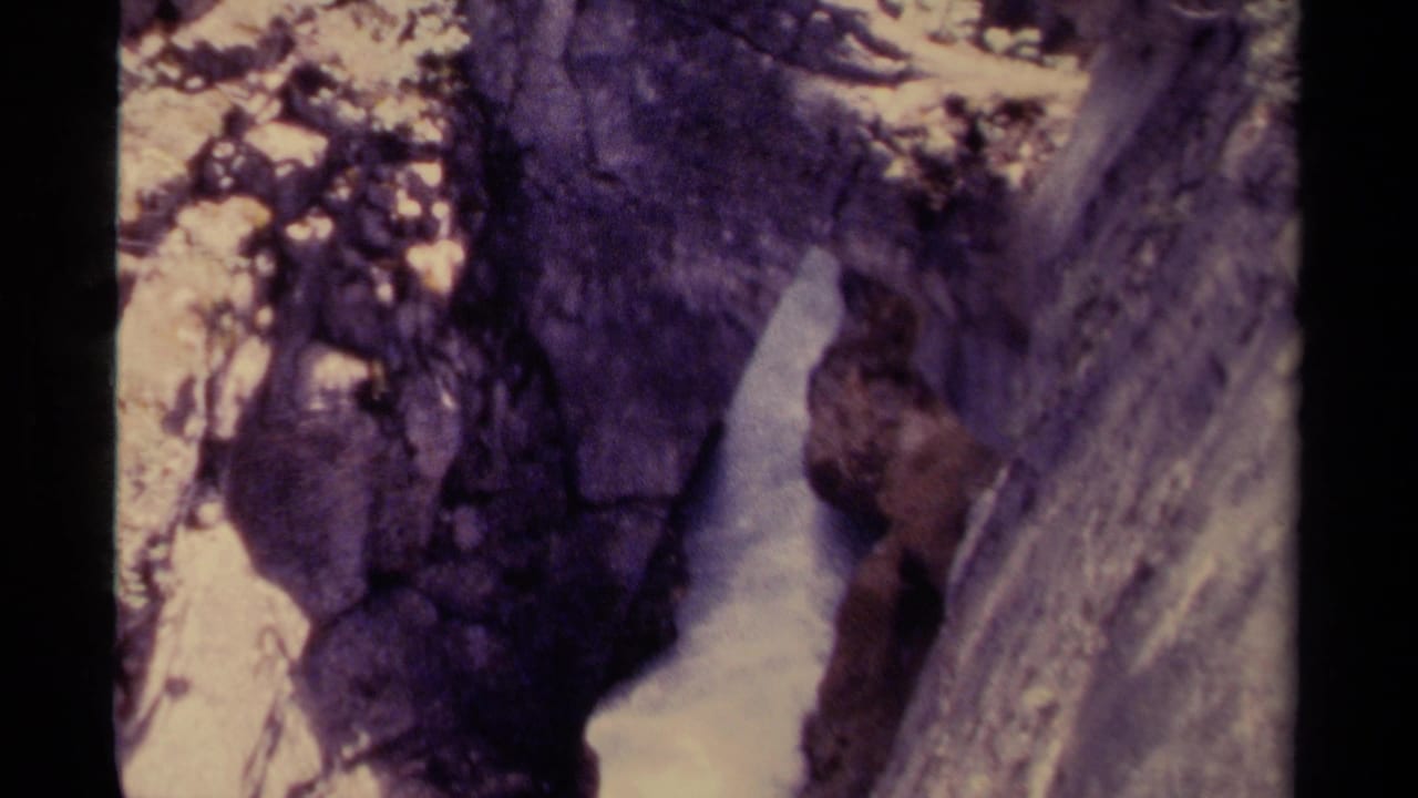 A similar canyon view shows white water beside steep rock faces.