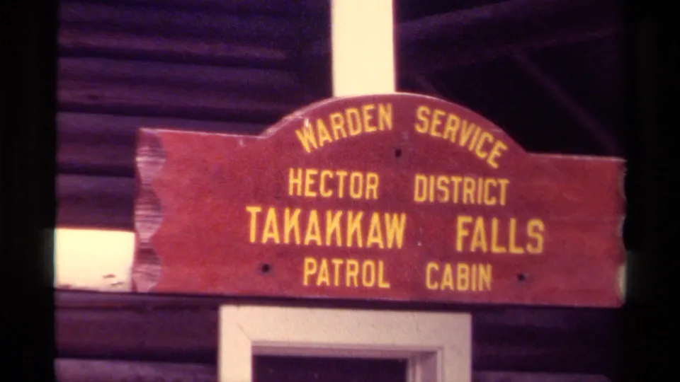 Wooden Warden Service Hector District sign for Takakkaw Falls Patrol Cabin, filmed in Canada on 8mm home-movie footage.