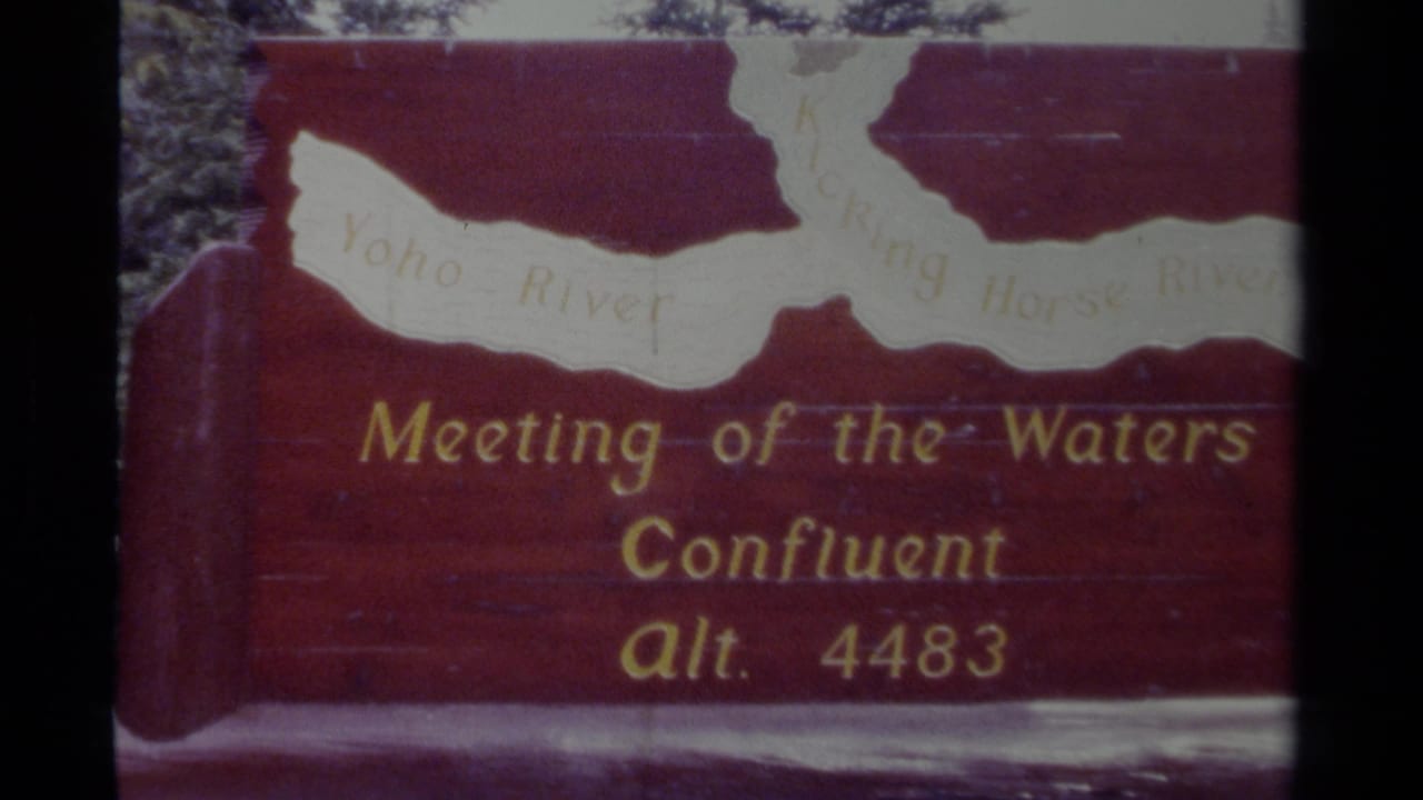 Close view of the Meeting of the Waters sign with map and gold text.