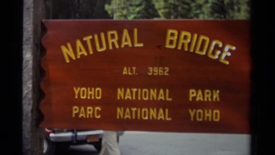 1979 Canadian park frame showing the wooden Natural Bridge sign, altitude 3962, for Yoho National Park.
