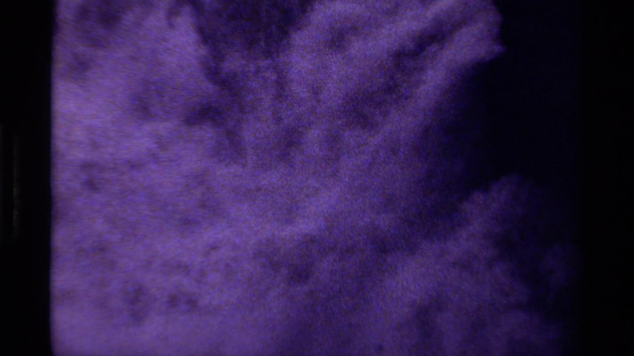 Soft purple texture with a large dark area along the right edge.