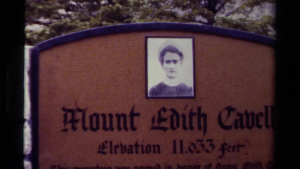 1979 8mm Canada footage showing the Mount Edith Cavell sign, its portrait panel, and elevation wording near trees.