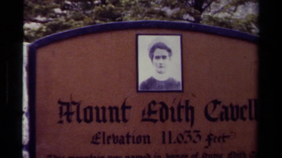 1979 Canada home-movie frame showing a Mount Edith Cavell sign with a portrait panel and elevation text partly visible.