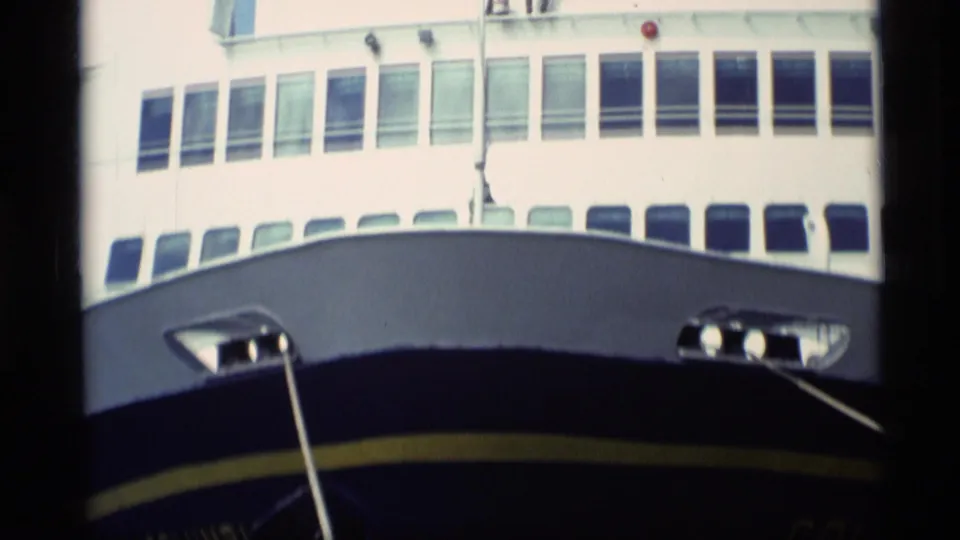1977 Alaska home-movie view of the Columbia's bow, upper windows, and mooring lines while docked.