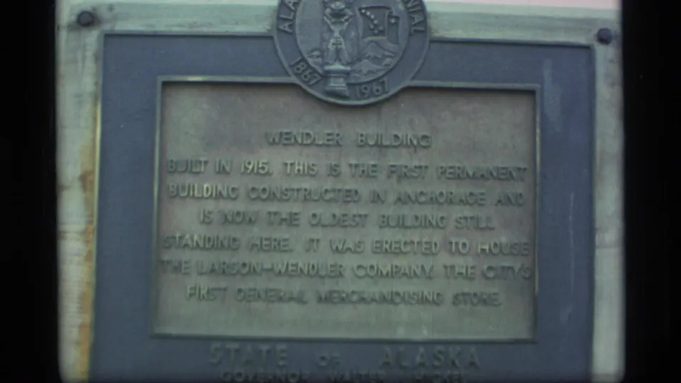 Close archival view of the Wendler Building marker, with text about the 1915 building and Alaska state emblem visible.