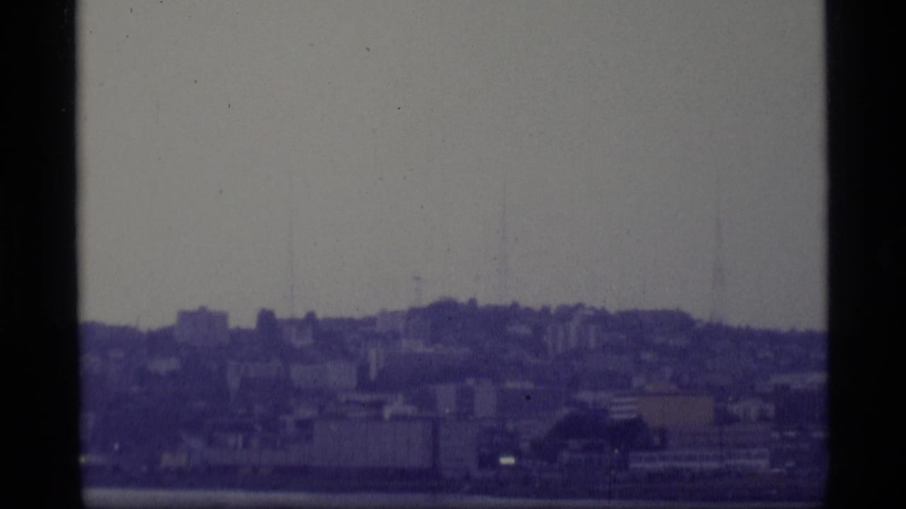 Soft distant skyline and waterfront seen through 8mm frame borders.