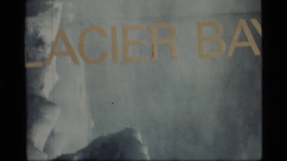 1977 Glacier Bay, Alaska home-movie frame with cropped yellow GLACIER BAY lettering over an icy-toned surface.