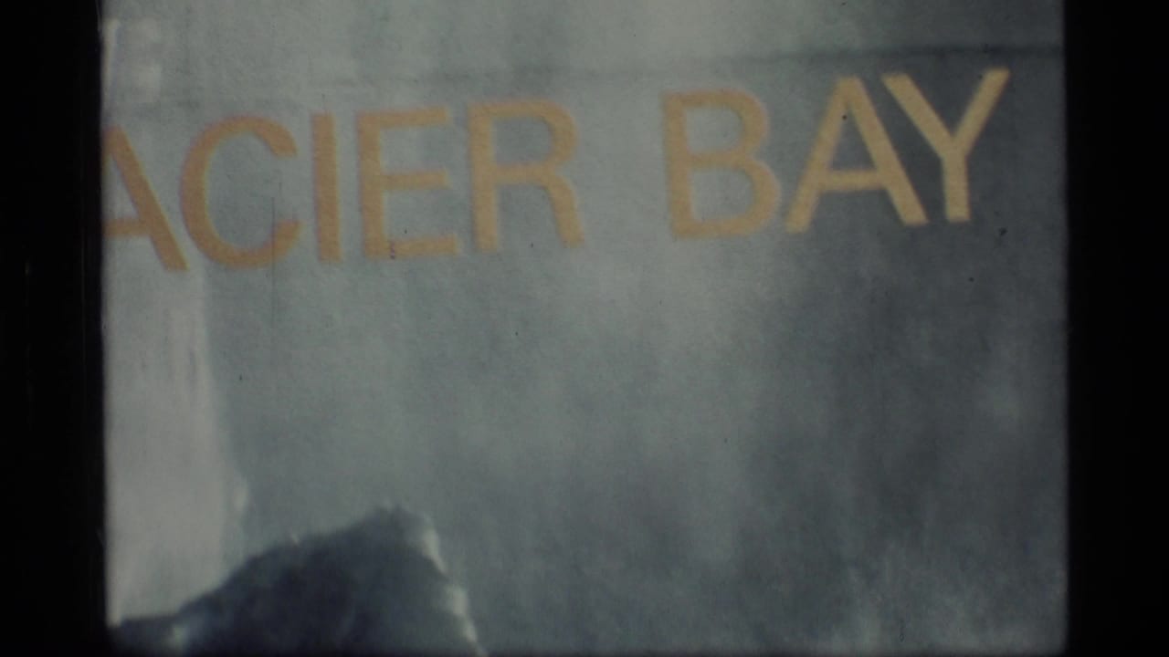Projected title text reading Glacier Bay, partly cropped and softly focused.