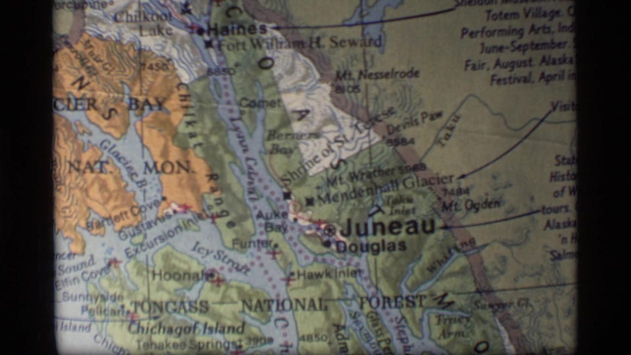 Printed map section with Juneau, Douglas, Haines, and Glacier Bay area labels.
