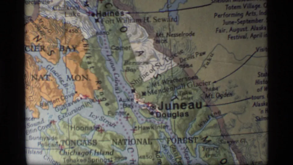Soft 8mm view of a southeast Alaska map with Juneau and Douglas near the center and Haines visible above.