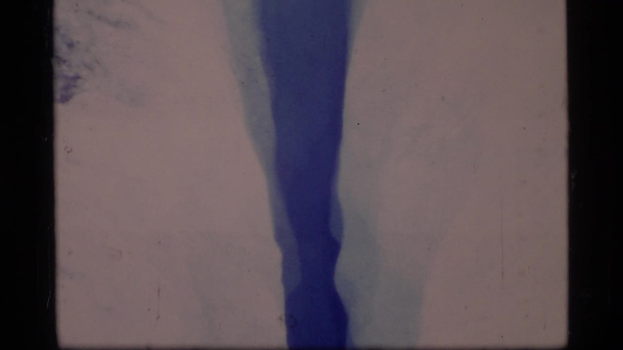 A closer 1977 Glacier Bay view shows the crevasse narrowing between pale ice walls with blue shadowing.