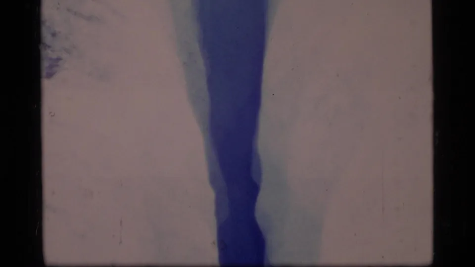 A closer 1977 Glacier Bay view shows the crevasse narrowing between pale ice walls with blue shadowing.