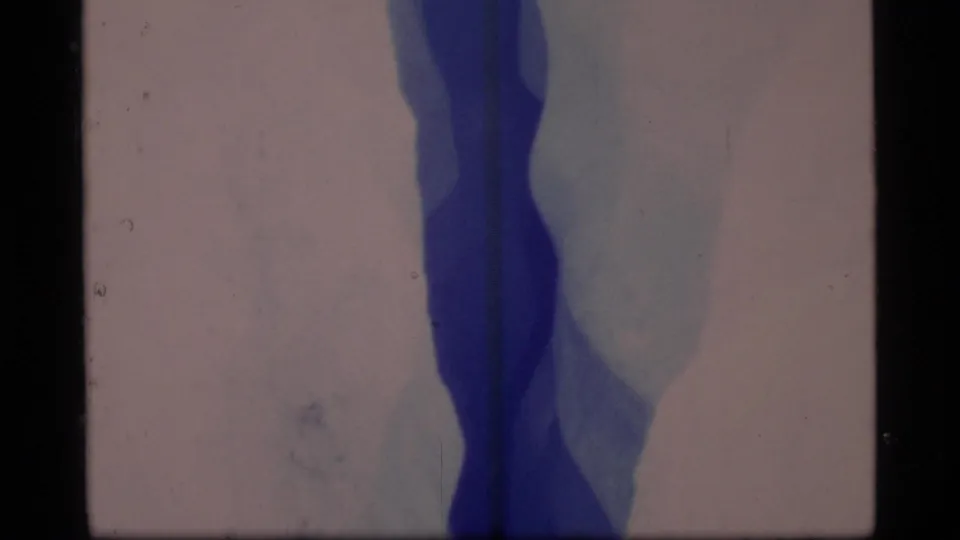 A tight 1977 Glacier Bay frame shows blue crevasse depth, pale jagged ice edges, and scanned 8mm frame borders.