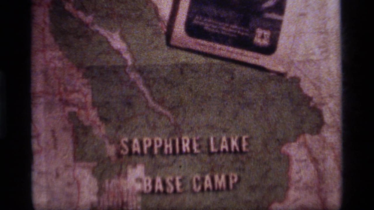 Map title frame with Sapphire Lake Base Camp lettering and a small card near the top edge.