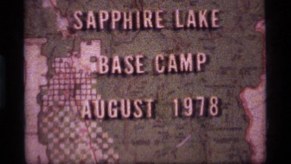 A slightly shifted 8mm frame of the Sapphire Lake Base Camp title card, with August 1978 visible across the lower portion.