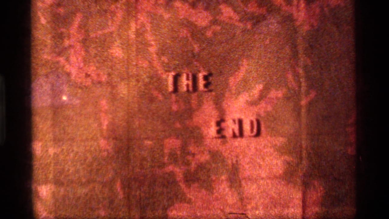Sapphire Lake, Montana 1977 8mm closing card with raised "THE END" text over a grainy orange background.