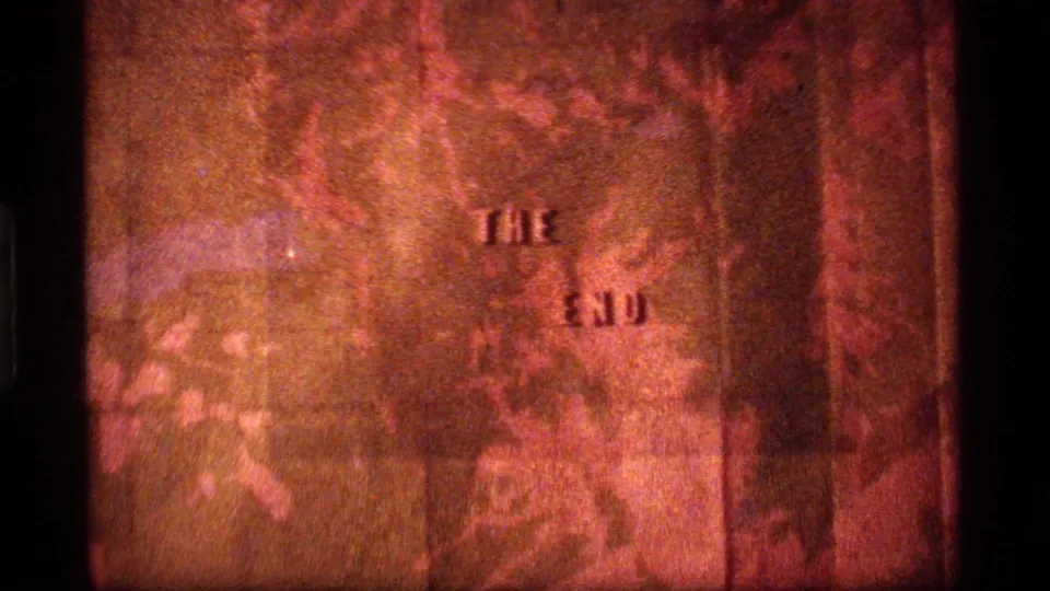 Sapphire Lake, Montana 1977 closing title frame with raised "THE END" text softened by grain and warm exposure.