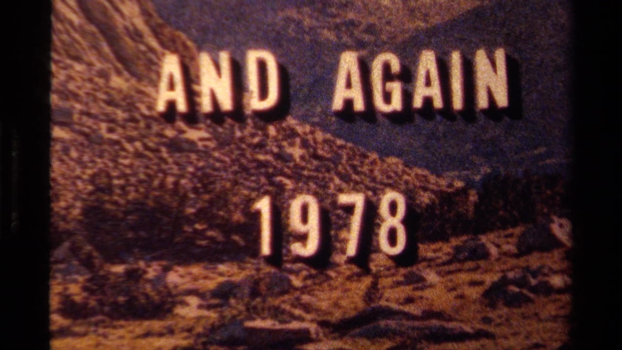 1978 8mm title card reading AND AGAIN 1978 over a rugged Lake Tahoe mountain landscape with dark film borders.