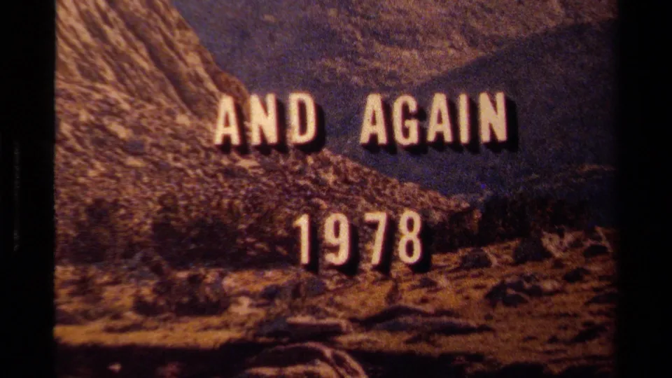 Final 1978 title-card frame over Lake Tahoe mountain terrain, with white lettering, rocky slopes, and visible film-frame edges.