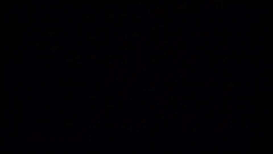 Dark opening frame from a 1979 British Columbia 8mm home movie, with little visible detail beyond film border and faint exposure.