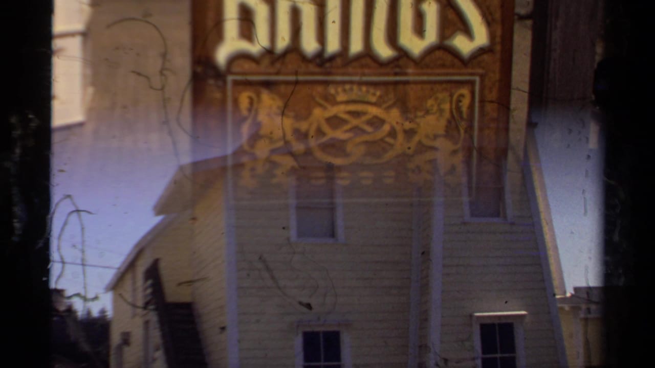 Pastries sign overlaps a yellow wood-sided building in a layered exposure.