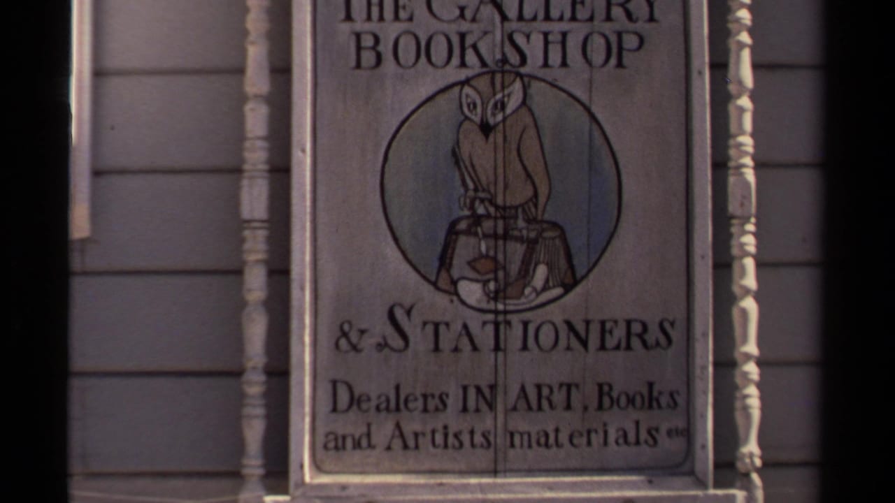 Second view of The Gallery Bookshop and Stationers sign beside exterior trim.