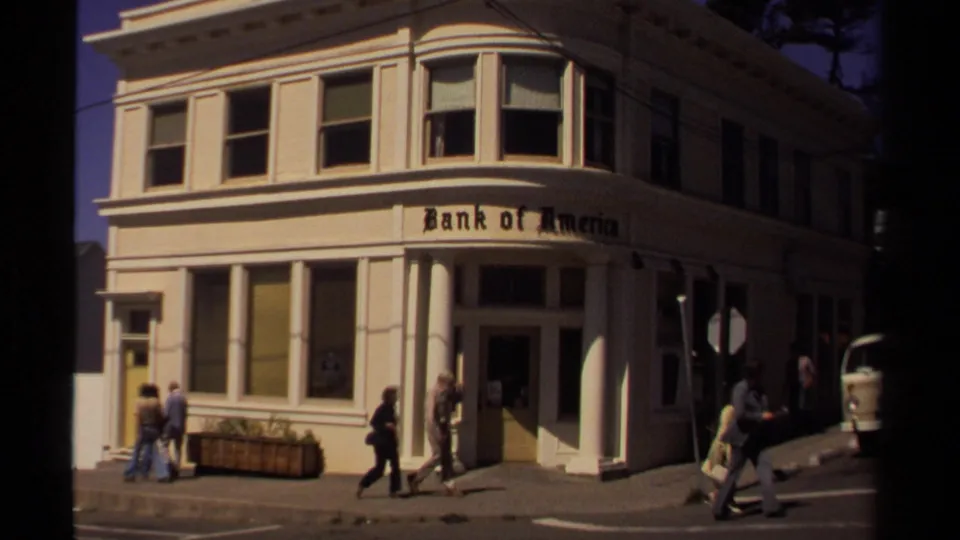 1980 Mendocino street scene showing a Bank of America corner facade with several pedestrians passing the storefront.