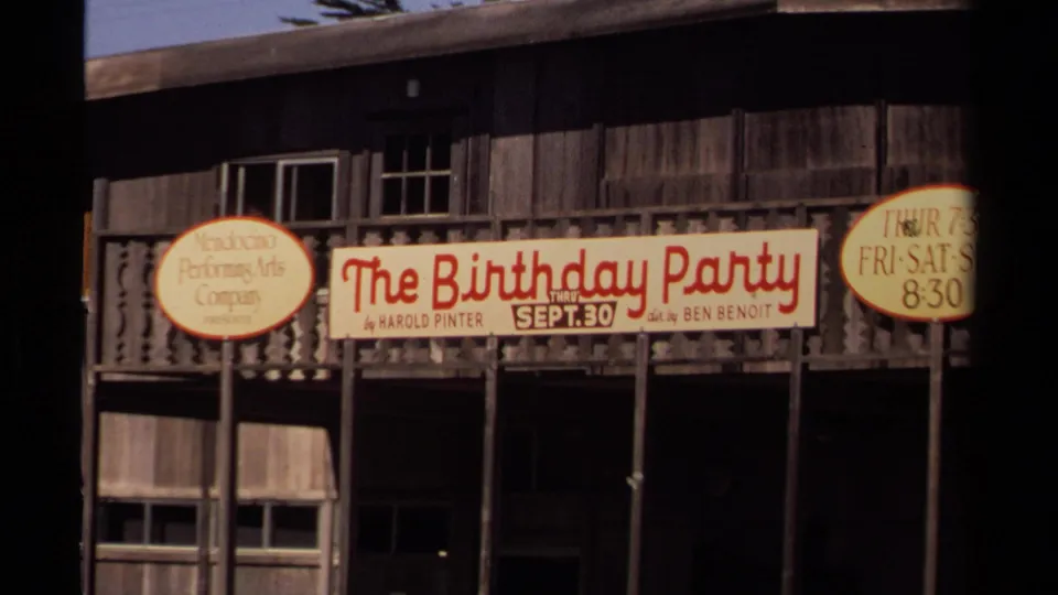 Wide view of the Mendocino Art Center exterior with theater signage and rustic woodwork in 1980 footage.