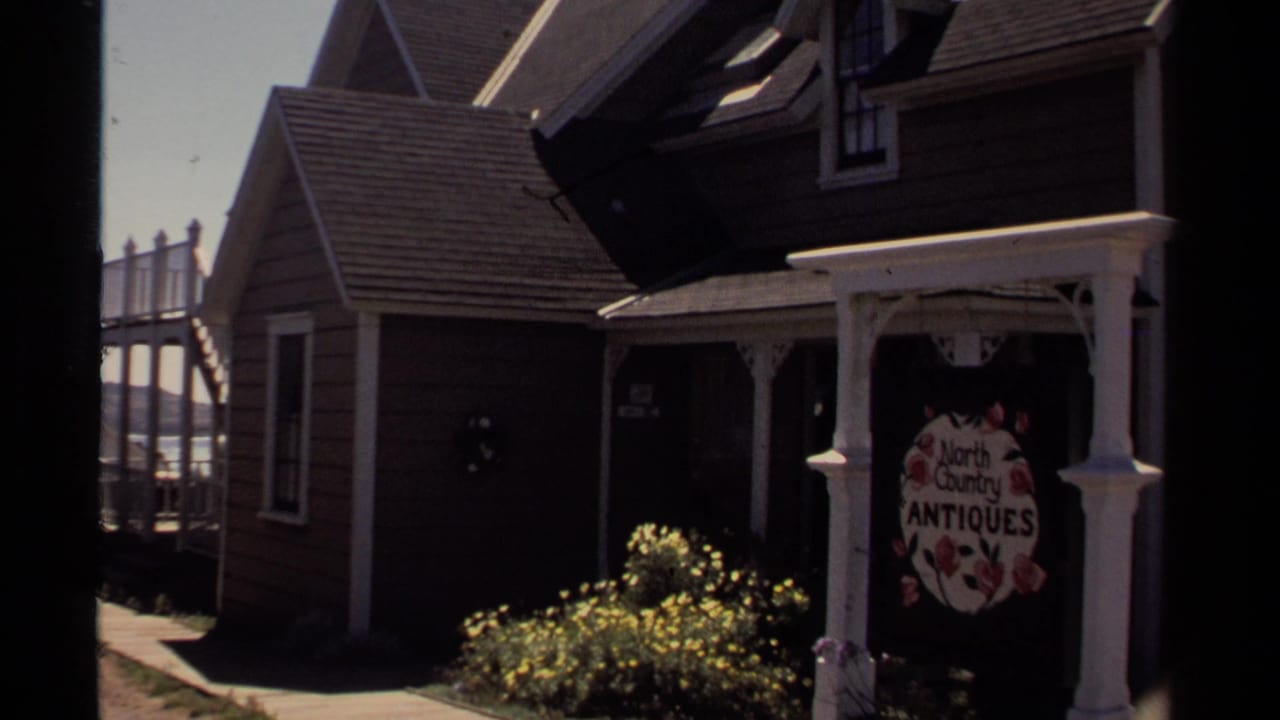 Antique shop exterior with North Country Antiques sign on a porch.