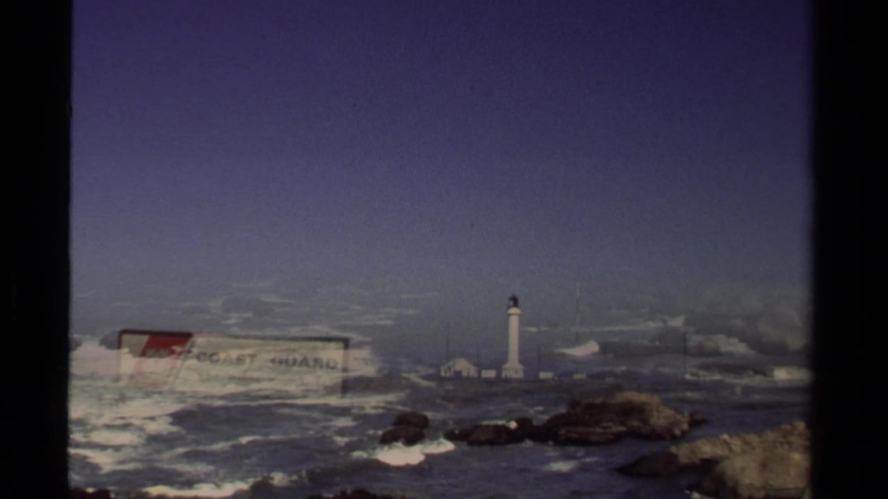 1980 8mm frame with a partial dissolve or overlap between the Coast Guard sign, Point Arena Lighthouse, and Pacific surf.