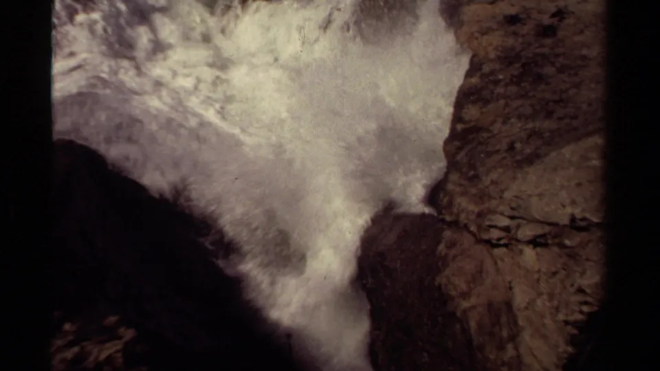 Spray and white water swell through the Mendocino rock passage in grainy 8mm home-movie footage.