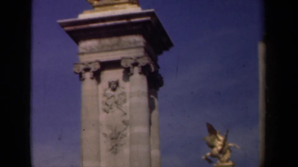 1939 Paris frame of an ornate stone pedestal with relief carving, cornice detail and a gilded winged horse sculpture partly visible to the right.