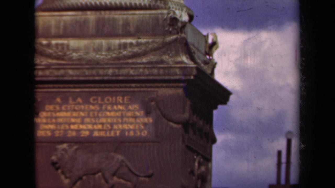 Close view of monument stonework with French inscription and lion relief.