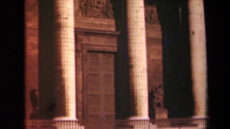 1939 Paris footage shows the lower neoclassical facade with fluted columns, a recessed doorway, and warm film color.