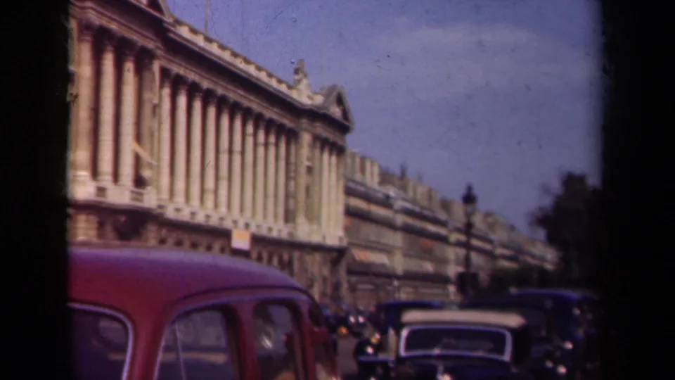 The final frame shows 1939 Paris street traffic below a grand columned building, with multiple vintage cars visible.