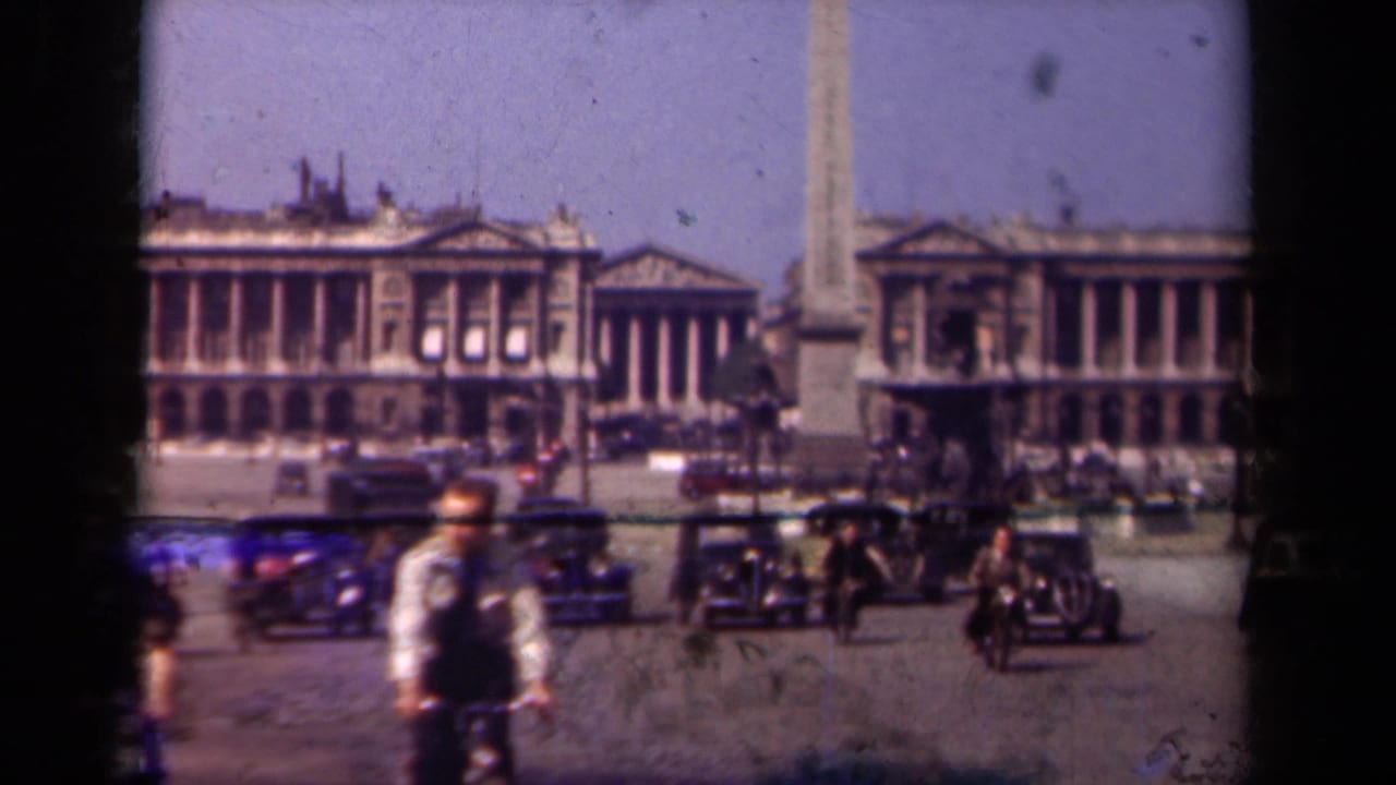 1939 Paris home-movie view of Place de la Concorde, with the Obelisk of Luxor, cyclists, pedestrians, and period cars in motion.