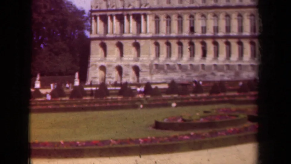 The final frame holds a wider 1939 Paris garden composition with curved flowerbeds, lawn, trees, distant visitors, and the arched facade.