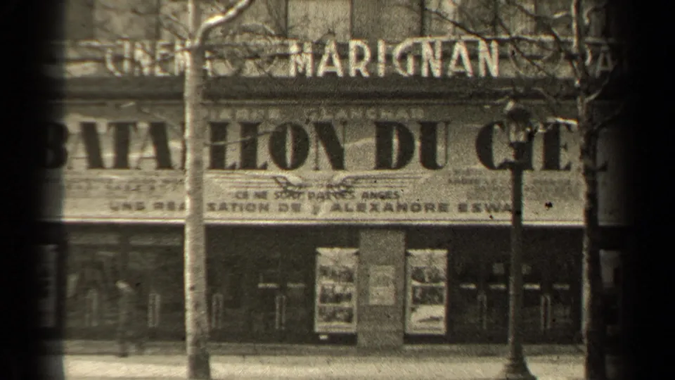 1947 Paris street view facing Cinéma Marignan signage, with bare trees, lampposts, sidewalk frontage, and poster displays.