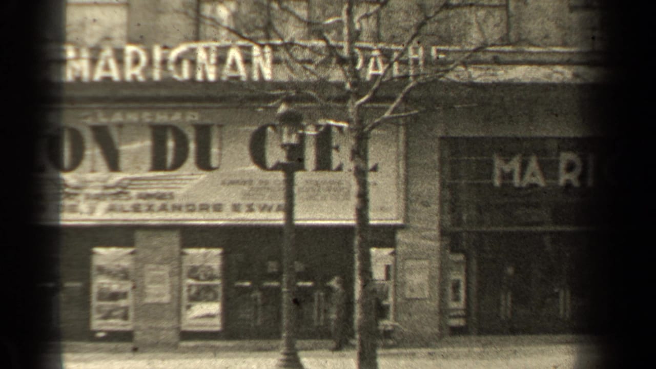 1947 Paris exterior with partial Cinéma Marignan lettering, poster cases, a lamppost, bare trees, and adjacent storefront signage.