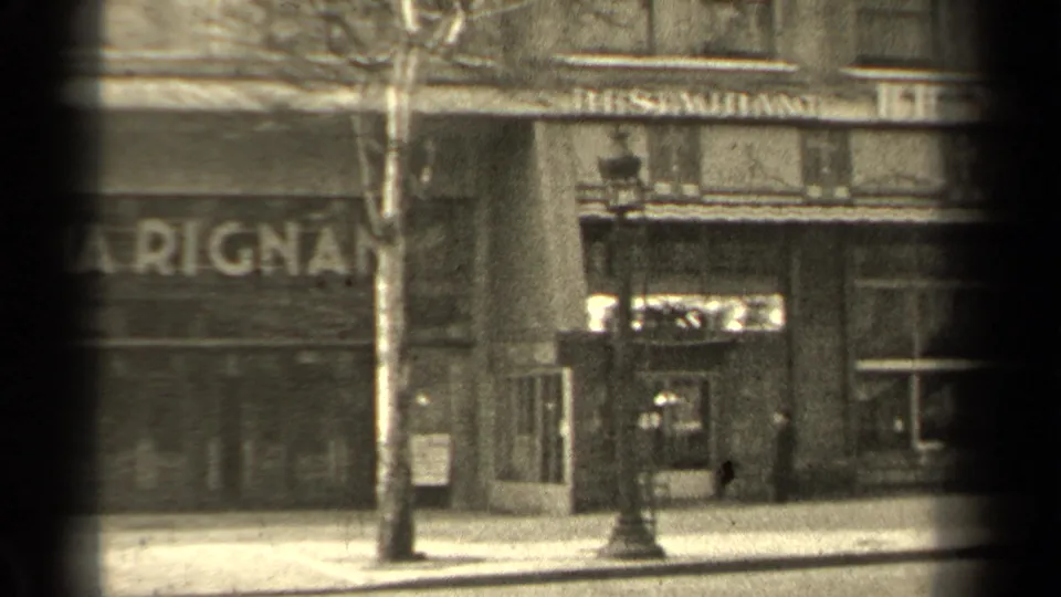 1947 Paris sidewalk view with Les Relais sign, Marignan lettering, lamppost, bare tree, and a pedestrian near the street edge.