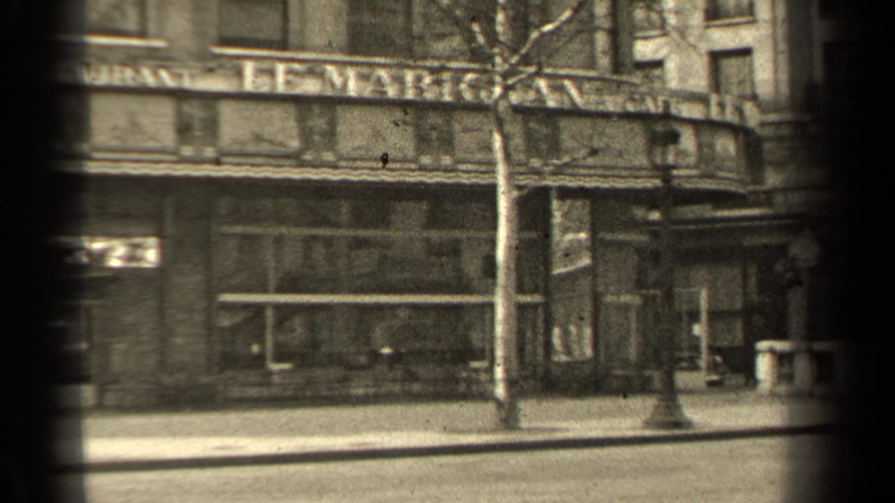 Paris storefront facade in 1947 with Le Marignan signage partly visible, a bare tree, lamppost, and empty street foreground.